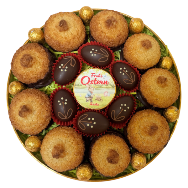 Großes, rundes Osternest mit Kokoskuppeln, Nougat, Schokoeiern & großer Schleife