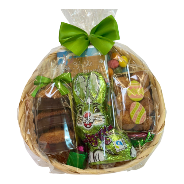 Kunterbunte Ostern Korb mit Schoko-Hasen, Dragées, Pralinen und Ostergebäck - schön verpackt