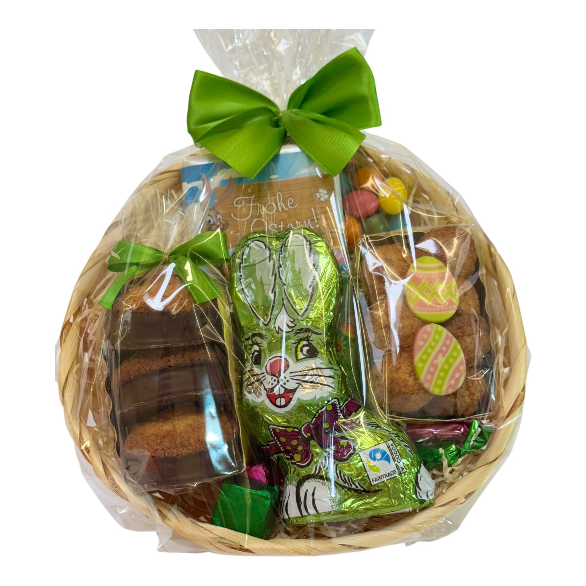 Kunterbunte Ostern Korb mit Schoko-Hasen, Dragées, Pralinen und Ostergebäck - schön verpackt
