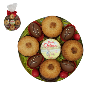 Rundes Osterpräsent mit Kokoskuppeln, Nougat, Osterdekor und roter Masche